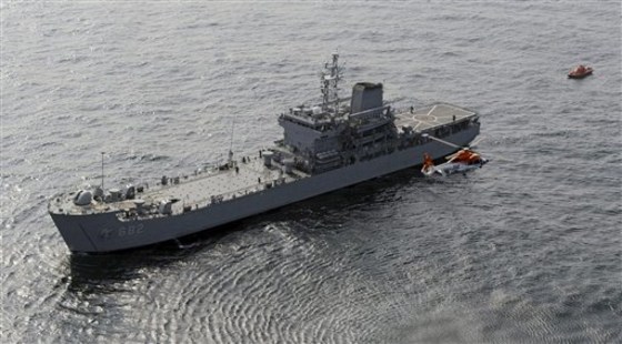 In this photo released by the Defense Ministry of South Korea, a fake suspicious ship is chased by warships from South Korea and Japan, unseen, during a multi-national exercise at sea between South Korea and Japan Thursday, Oct. 14, 2010.
